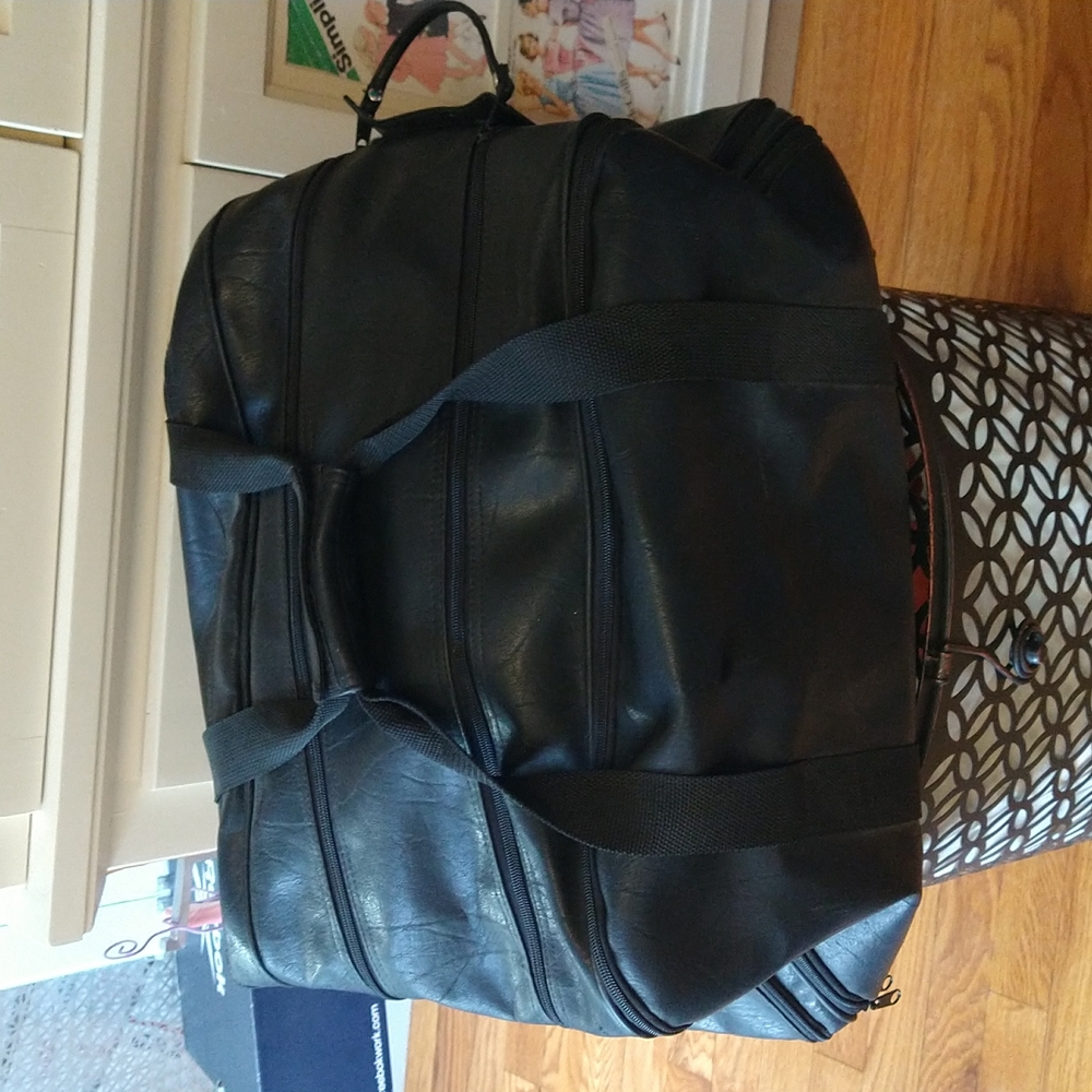 Black vinyl duffle bag from Foxwoods casino